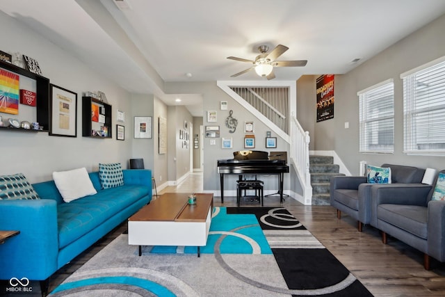 1413 S E St, Indianapolis, IN 46225 - living area featuring stairs, wood finished floors, a ceiling fan, and baseboards