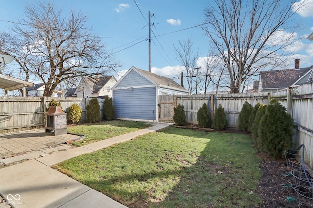 1413 S E St, Indianapolis, IN 46225 - view of yard with an outbuilding, a fenced backyard, and a patio