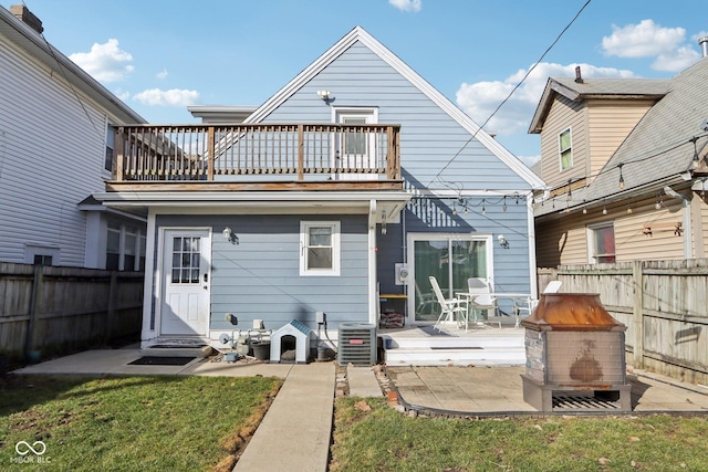 1413 S E St, Indianapolis, IN 46225 - back of property featuring central AC, a balcony, a patio area, and a fenced backyard
