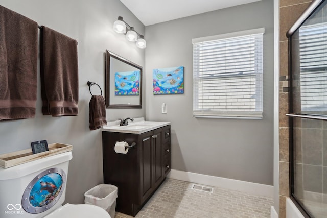1413 S E St, Indianapolis, IN 46225 - bathroom with visible vents, toilet, a shower with door, baseboards, and vanity