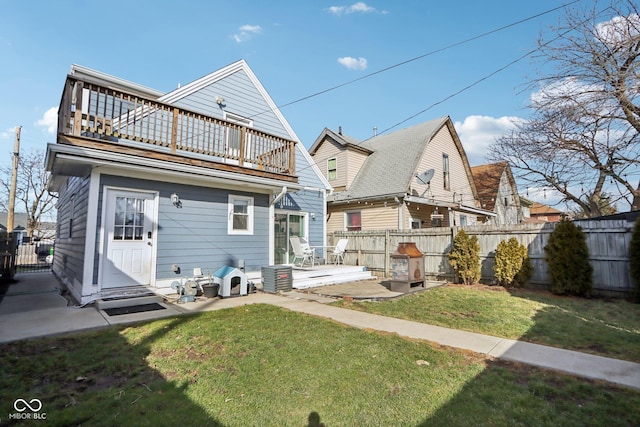 1413 S E St, Indianapolis, IN 46225 - back of property featuring a patio, a lawn, a balcony, and fence