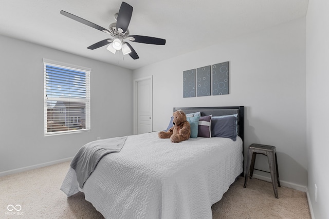 carpeted bedroom featuring ceiling fan and baseboards