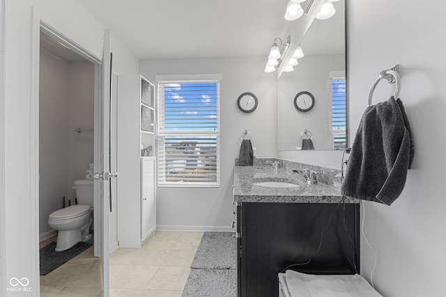 full bathroom with tile patterned flooring, baseboards, vanity, and toilet