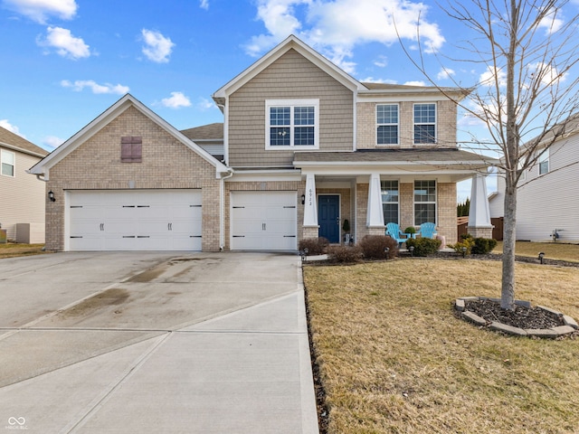 view of front of house featuring a garage, concrete driveway, a front yard, a porch, and brick siding