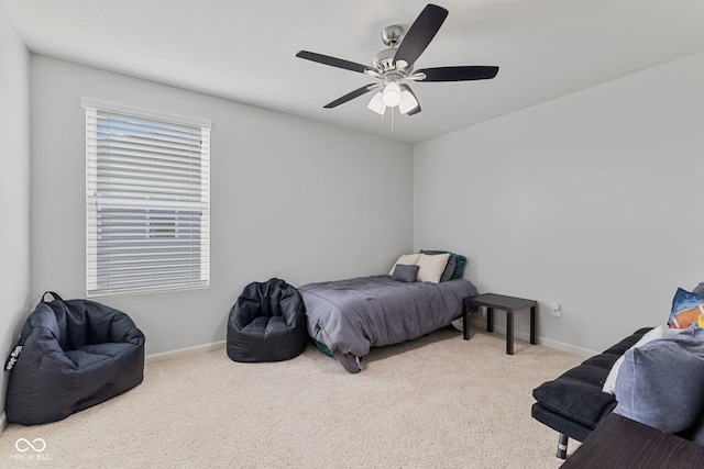 carpeted bedroom featuring a ceiling fan and baseboards