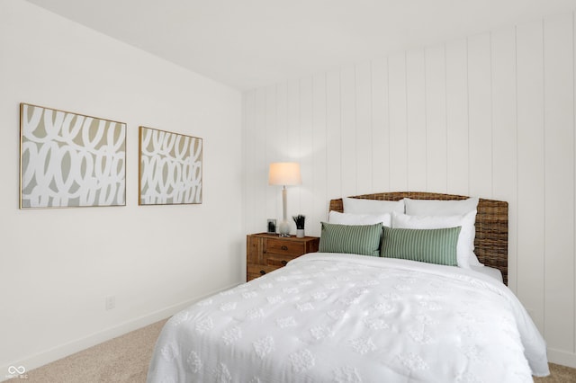 bedroom with baseboards and carpet flooring