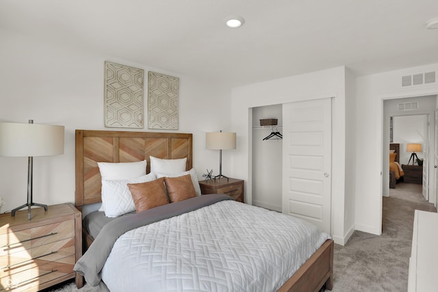 carpeted bedroom with recessed lighting, a closet, visible vents, and baseboards