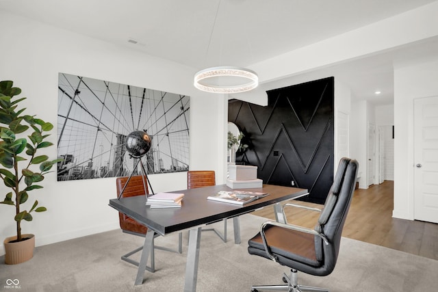 office space featuring wood finished floors and baseboards