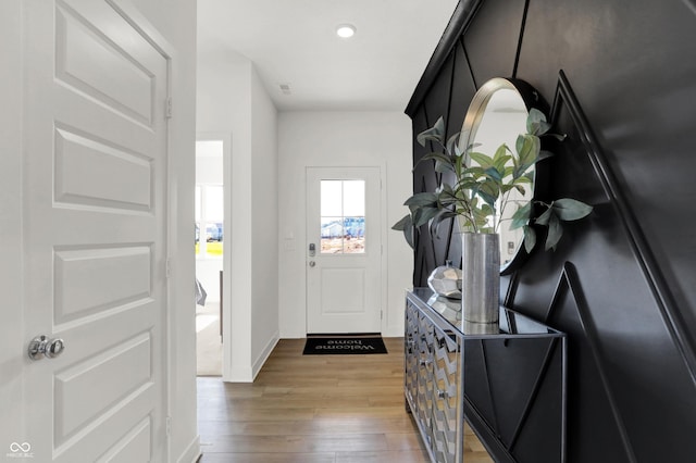 entrance foyer with recessed lighting, wood finished floors, and baseboards