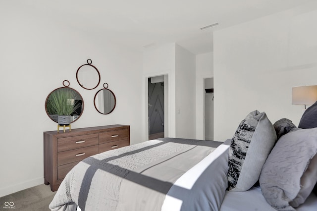 bedroom featuring light colored carpet, visible vents, and baseboards