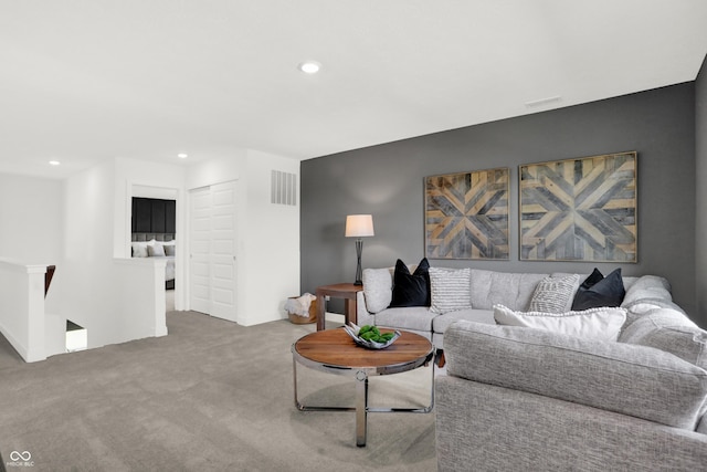 carpeted living room featuring recessed lighting and visible vents