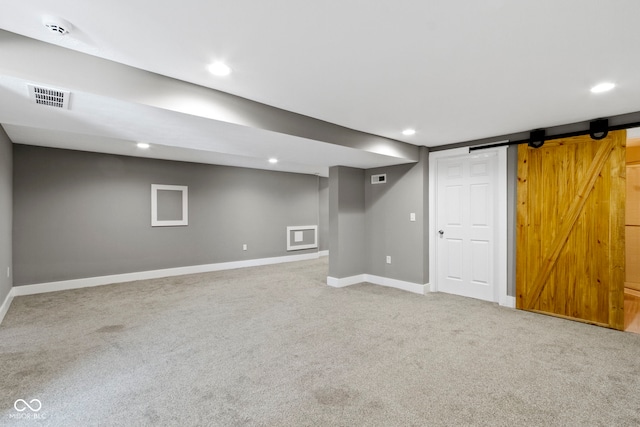 finished basement with recessed lighting, visible vents, baseboards, and carpet flooring