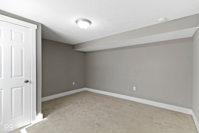 finished basement with baseboards and carpet flooring