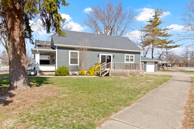 view of front of house with driveway, a front yard, and a garage