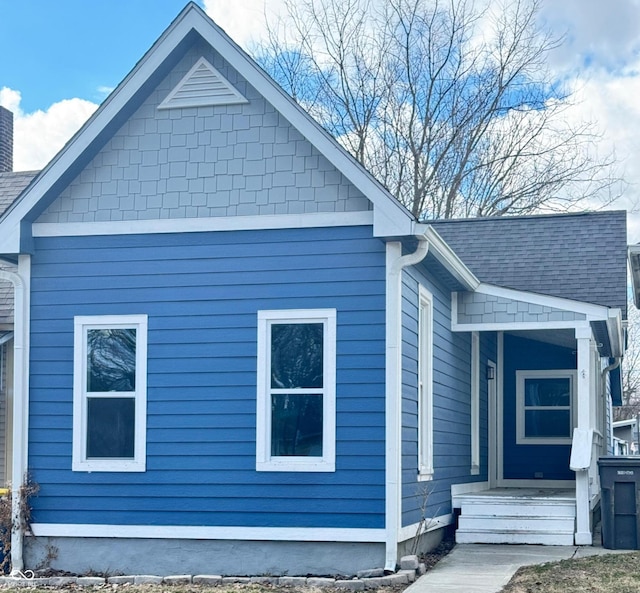 view of home's exterior featuring a shingled roof