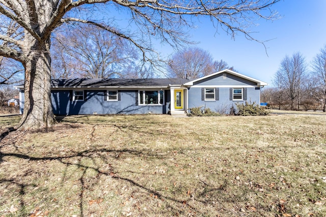 view of front of house with brick siding and a front lawn