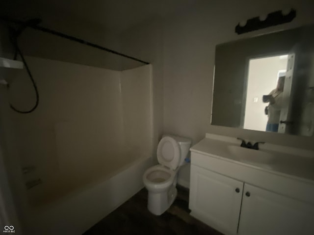 full bathroom with vanity, bathtub / shower combination, and toilet