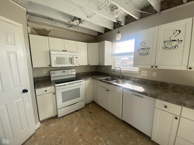 kitchen featuring white appliances, white cabinetry, and a sink