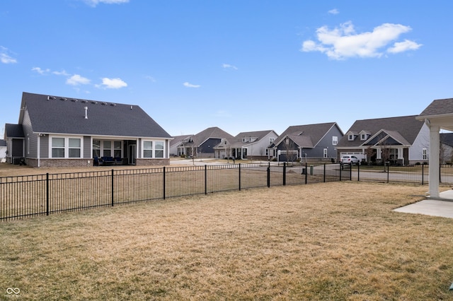 view of yard with a residential view and fence