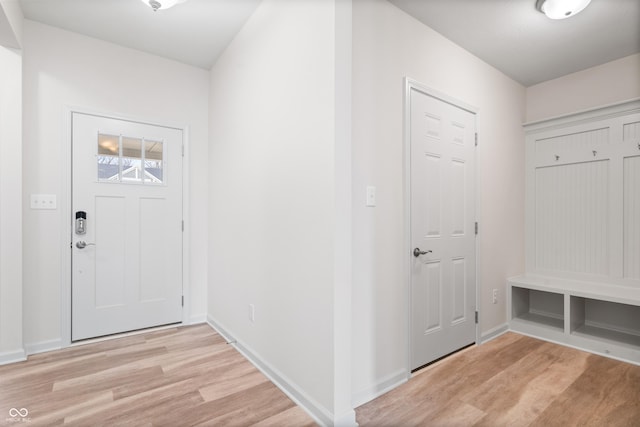 entrance foyer featuring light wood finished floors and baseboards