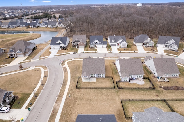 bird's eye view with a water view and a residential view