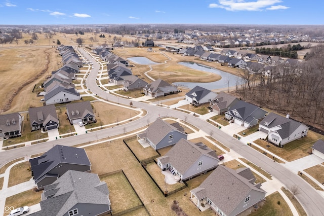 bird's eye view featuring a water view and a residential view