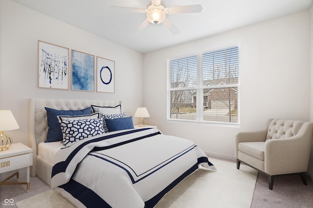 carpeted bedroom with baseboards and a ceiling fan