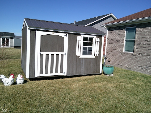 view of shed featuring fence