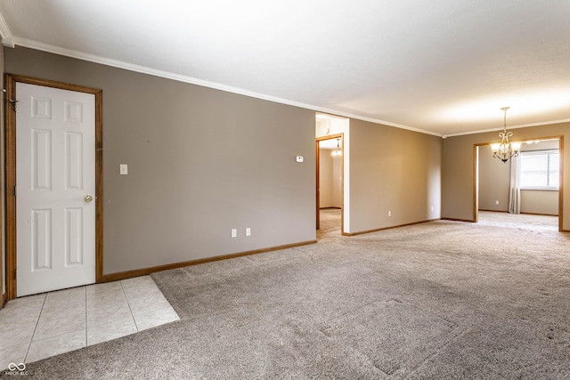 spare room with light tile patterned flooring, light carpet, crown molding, baseboards, and an inviting chandelier