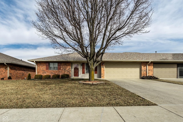 ranch-style home featuring an attached garage, brick siding, a shingled roof, concrete driveway, and a front yard