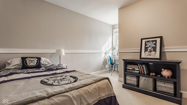 carpeted bedroom with baseboards