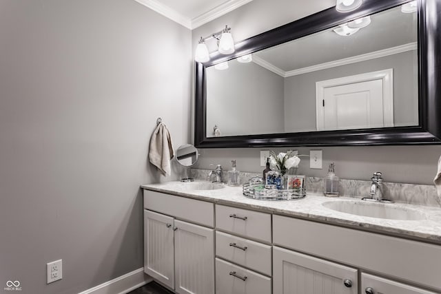 full bath with double vanity, a sink, and crown molding