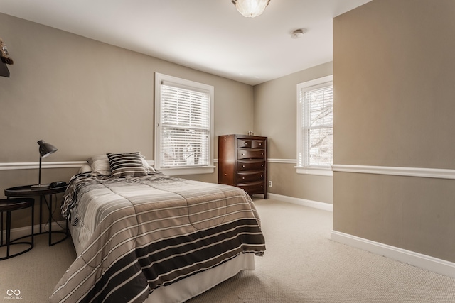 bedroom with carpet flooring and baseboards