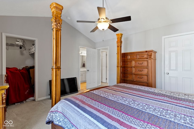 bedroom featuring connected bathroom, light colored carpet, vaulted ceiling, a spacious closet, and a closet