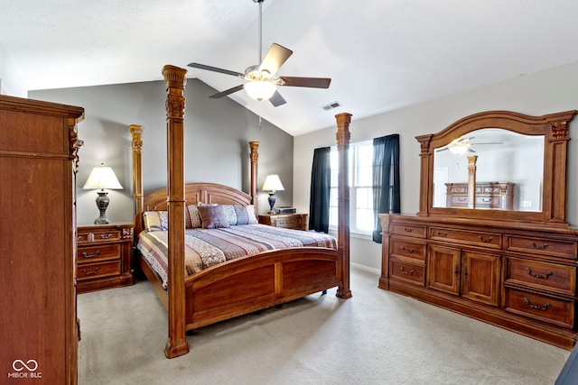 bedroom with light carpet, vaulted ceiling, visible vents, and a ceiling fan