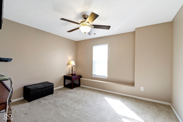 misc room featuring carpet floors, baseboards, and a ceiling fan