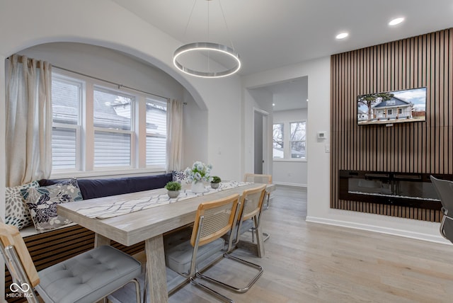 dining room with breakfast area, recessed lighting, baseboards, and wood finished floors