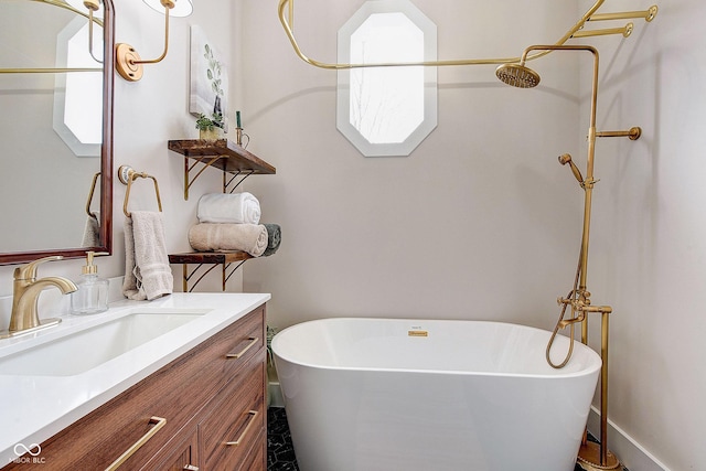 bathroom with a soaking tub and vanity