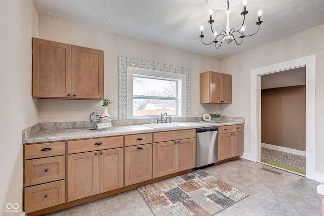 kitchen featuring a sink, visible vents, baseboards, light countertops, and dishwasher