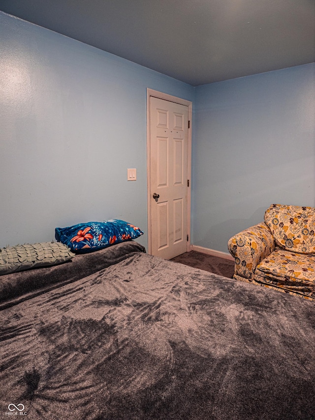 carpeted bedroom with baseboards