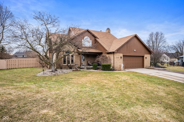 view of front of property with a chimney, fence, a front lawn, and brick siding