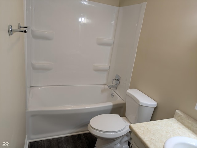 bathroom with bathtub / shower combination, vanity, toilet, and wood finished floors