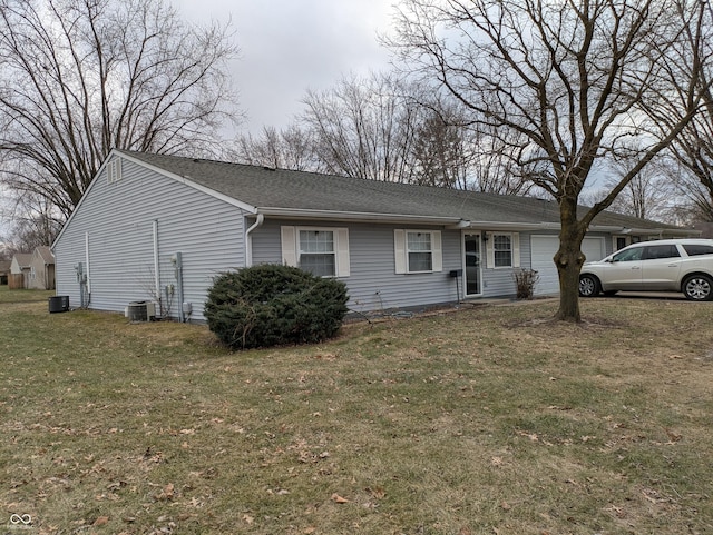 ranch-style home featuring a garage, a front lawn, roof with shingles, and cooling unit