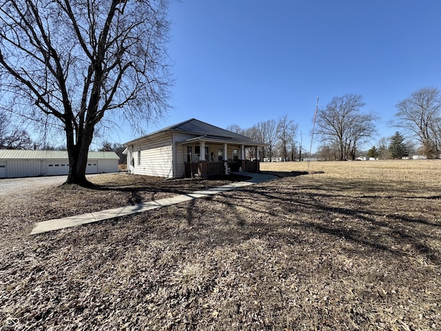 view of home's exterior with covered porch