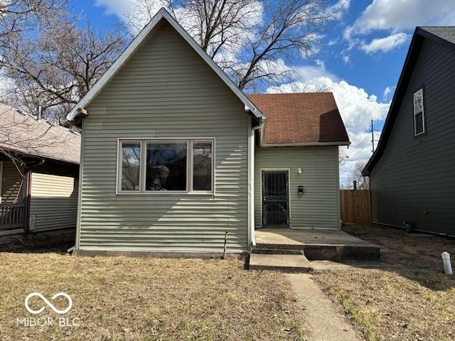 905 N Sheffield Ave, Indianapolis, IN 46222 - back of house featuring a shingled roof, a patio area, and fence