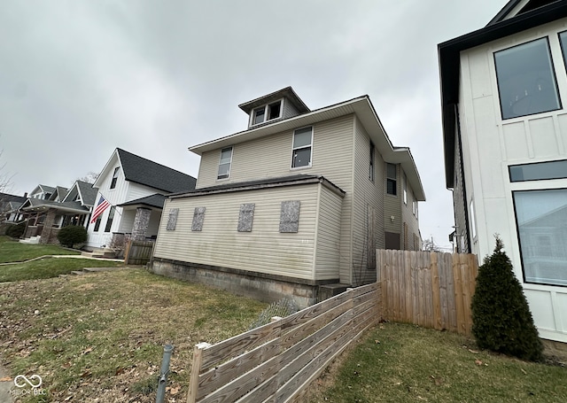 view of property exterior featuring fence