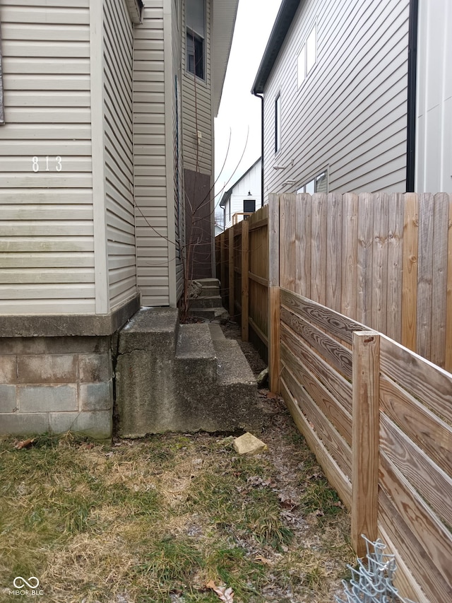 view of home's exterior featuring fence