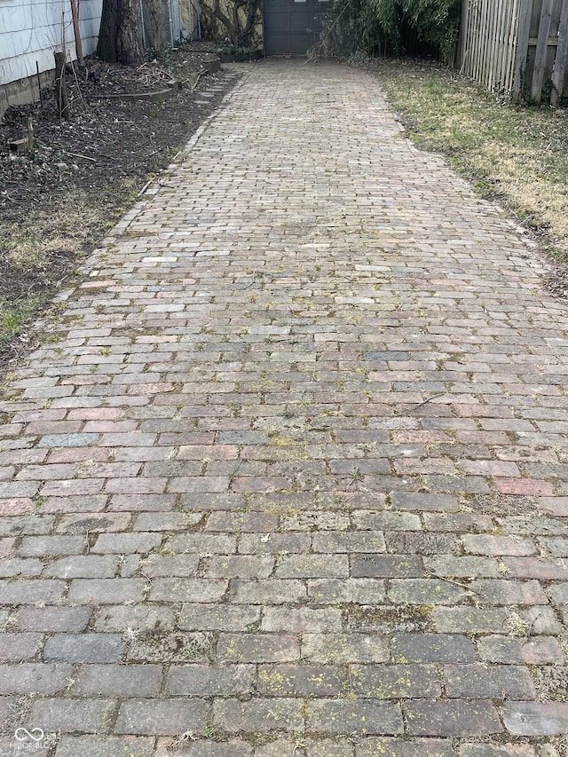 exterior details with decorative driveway