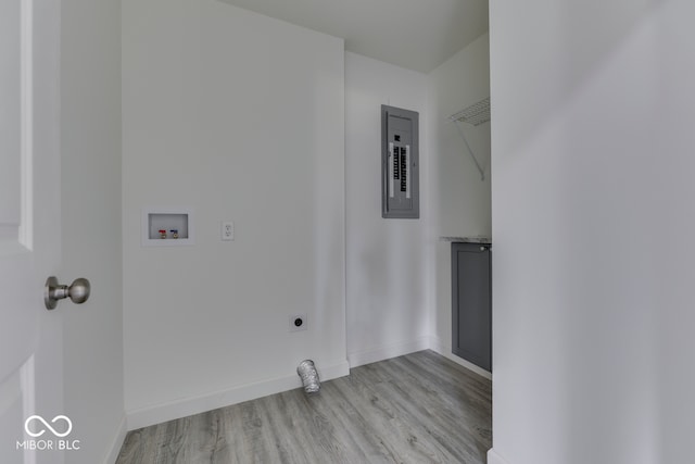 laundry room with hookup for an electric dryer, laundry area, washer hookup, electric panel, and light wood finished floors