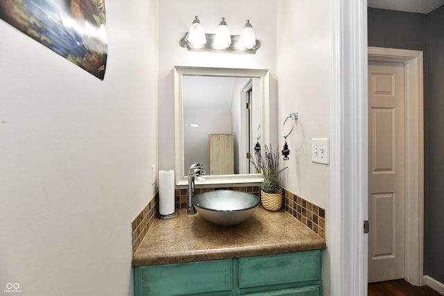 bathroom featuring tasteful backsplash and vanity